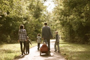 family walking with wagon