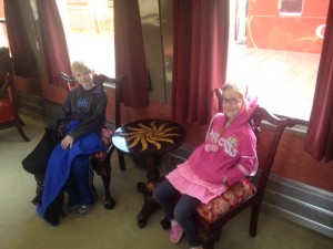 Austin and Emma enjoyed the comfort of the luxury train car. 